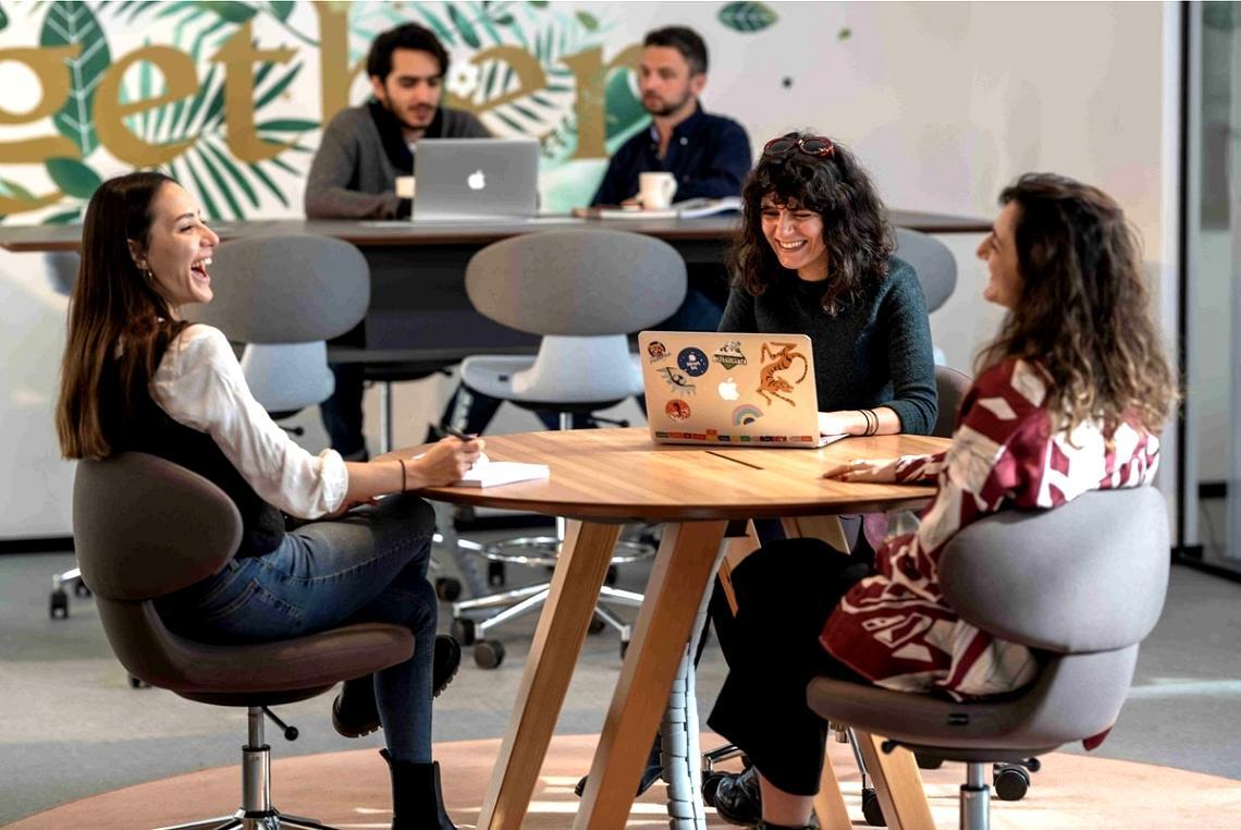 Student reviewing journalism course materials on laptop during study session